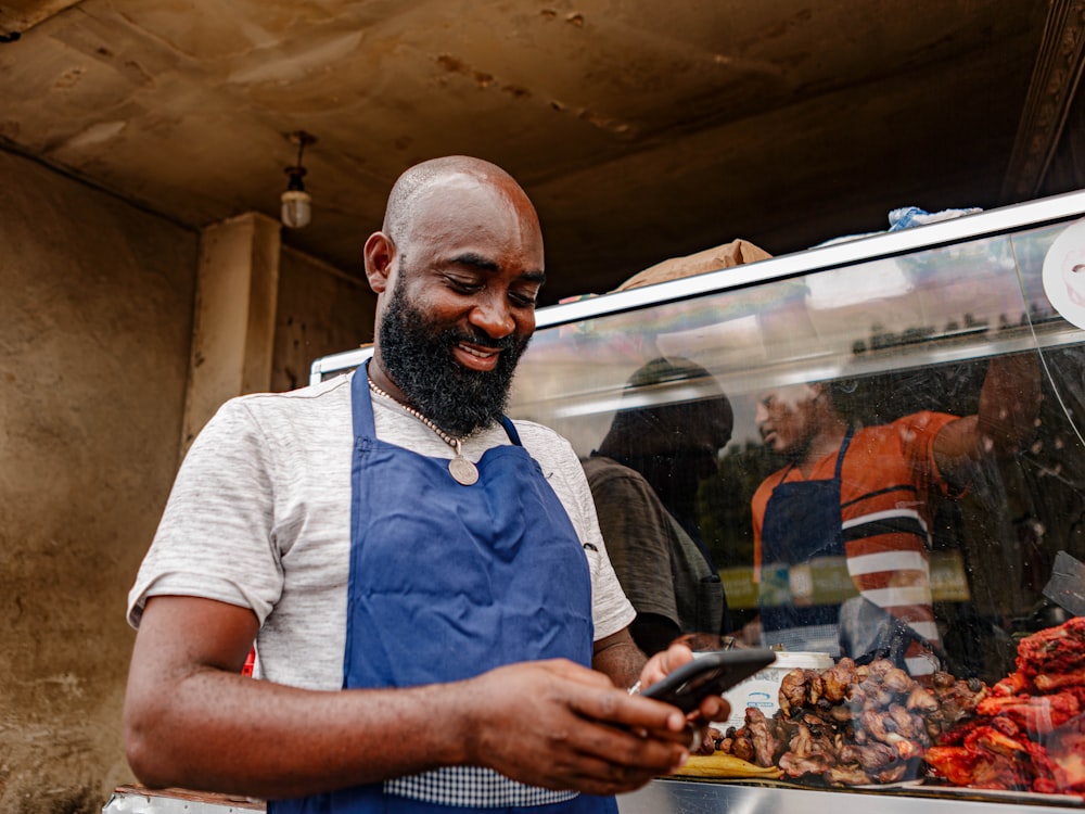 Small business owner checking his phone